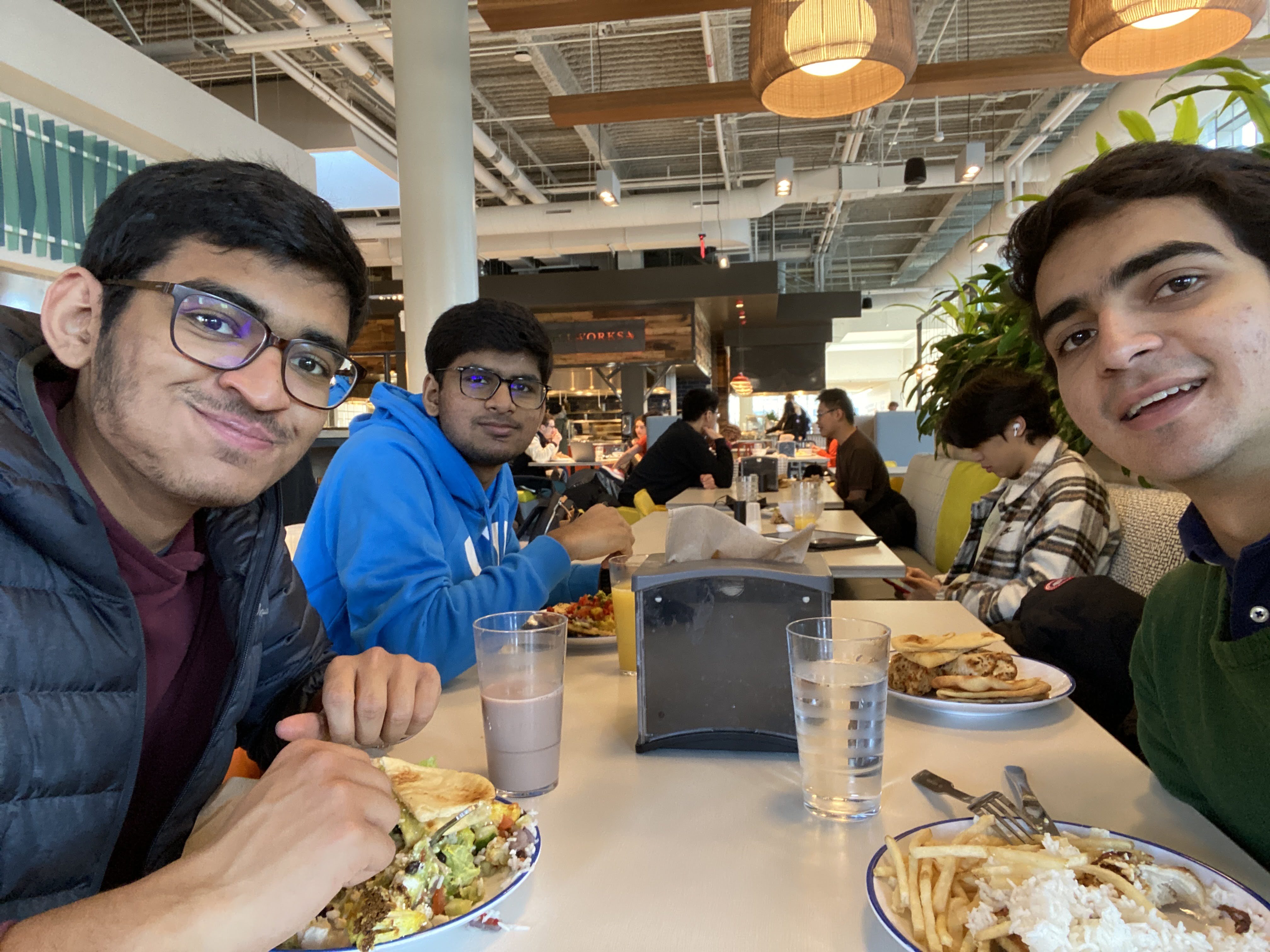 Arya, Aaryaman, and Juan David eating together in the ISR dining hall.
